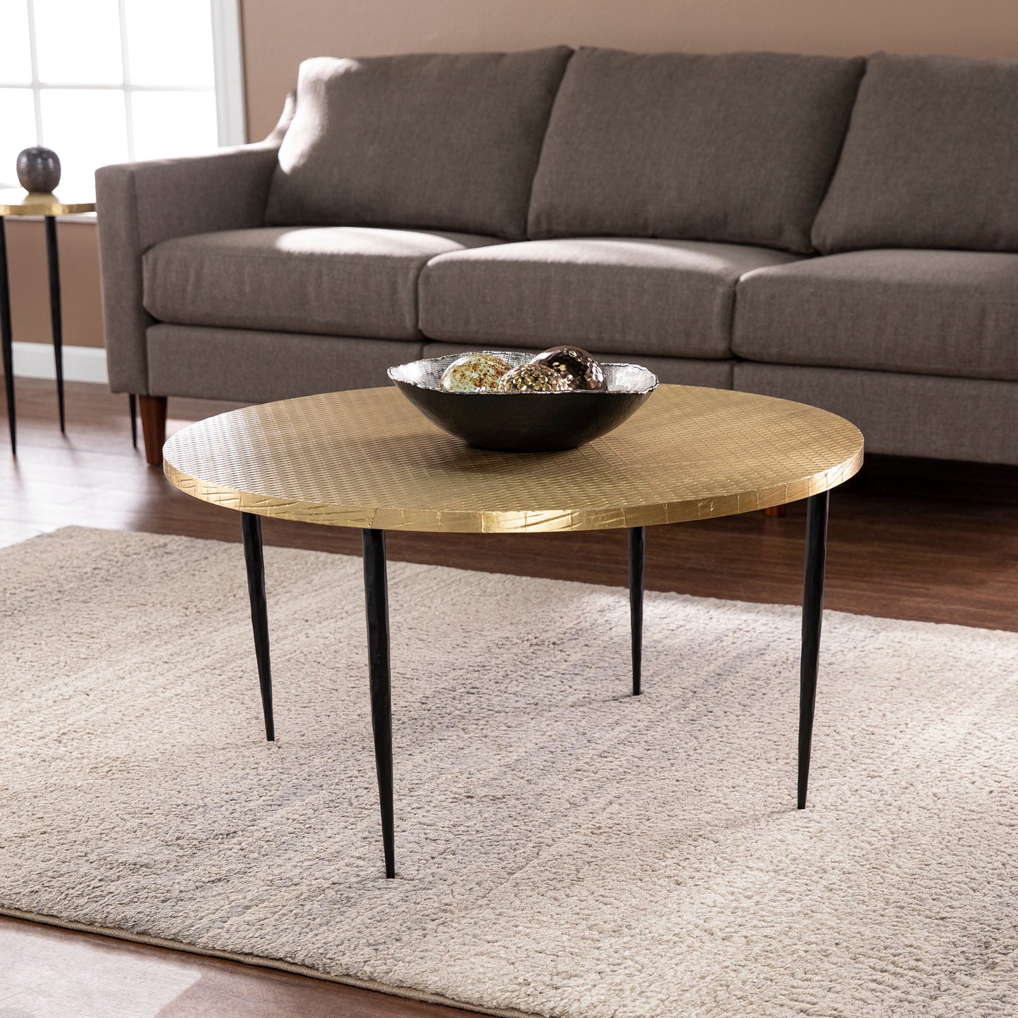 Round Cocktail Table with Embossed Top and Iron Legs