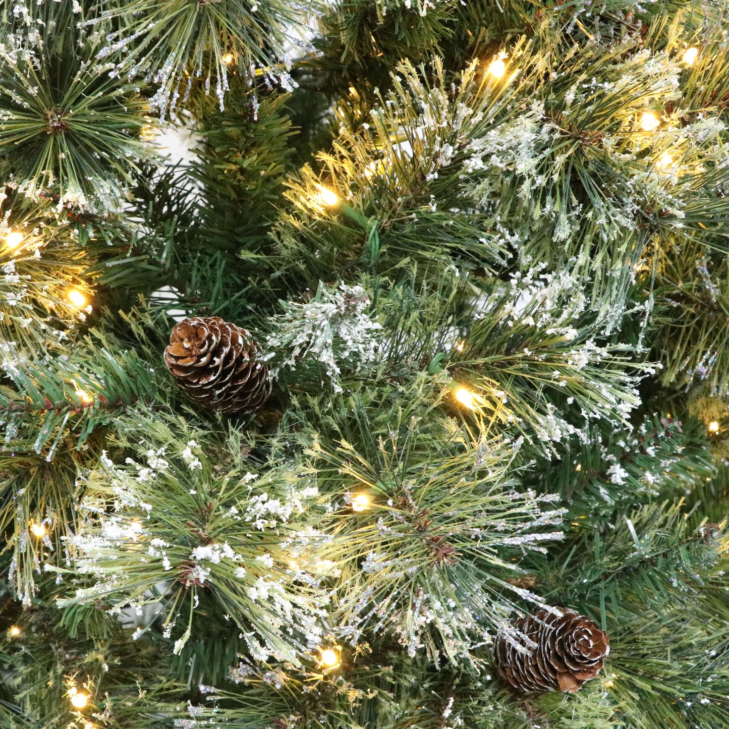 Lyzor 7 ft Brilste Mixed Hinged Christmas Tree with Snow, Glitter, 78 Frosted Pine Cones, 650 LED Lights