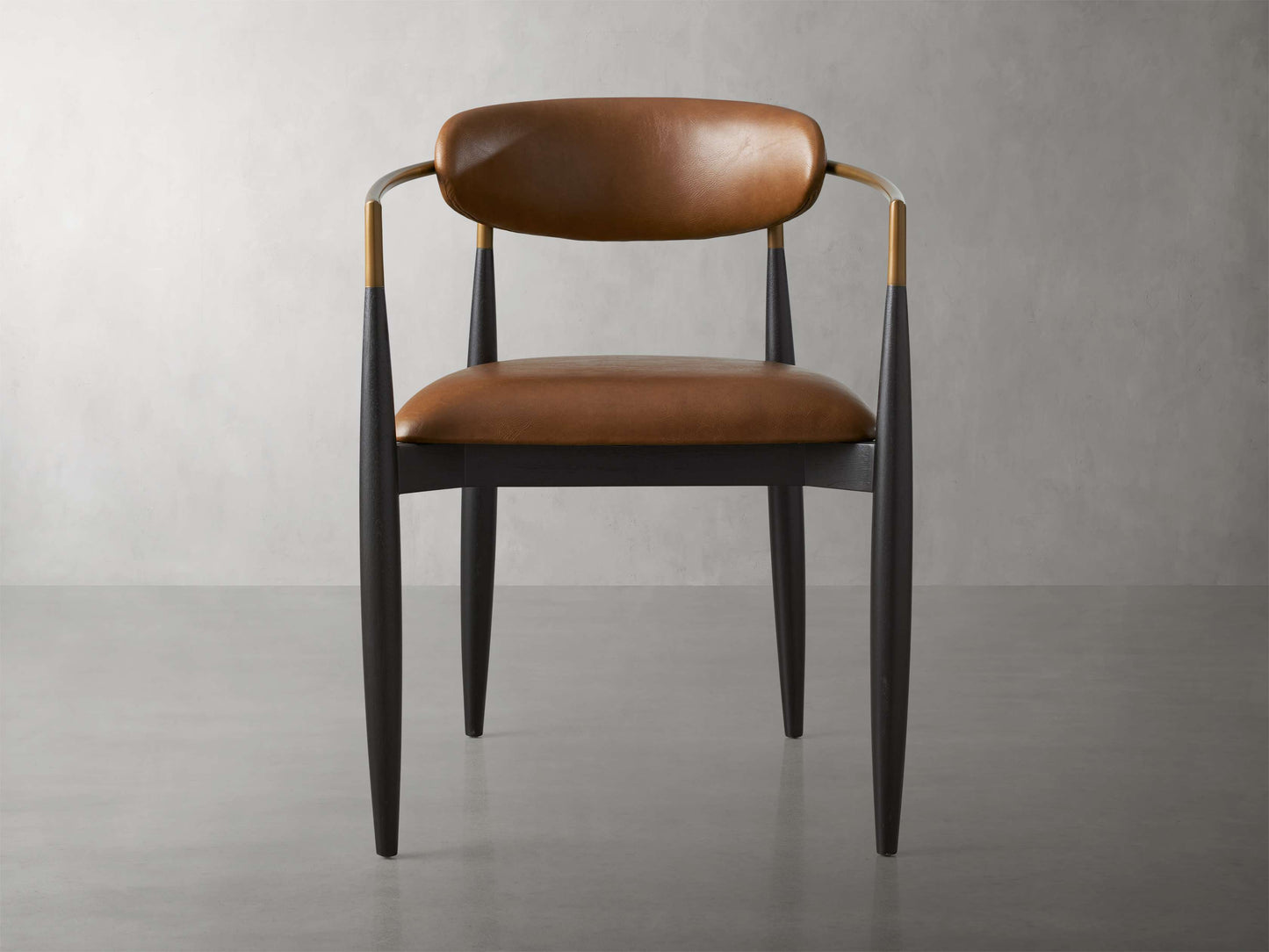 Jagger Faux Leather Dining Arm Chair in Black with Antique Brass