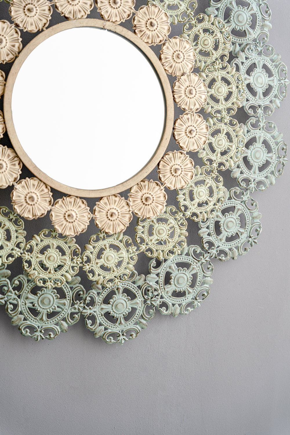 Round Wall Mirror with Floral Accents and Iron Scrollwork