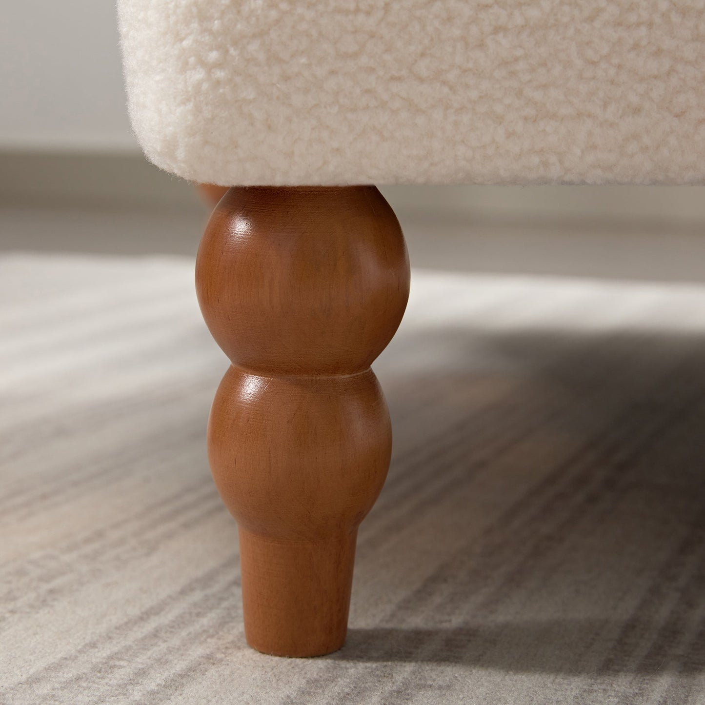 Upholstered Accent Chair with Circular Armrests and Roman Column Legs
