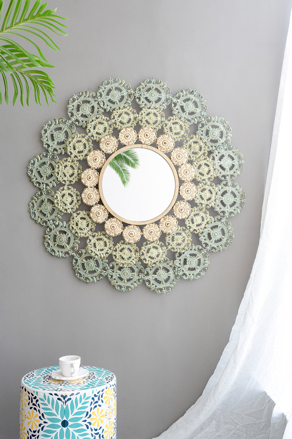 Round Wall Mirror with Floral Accents and Iron Scrollwork