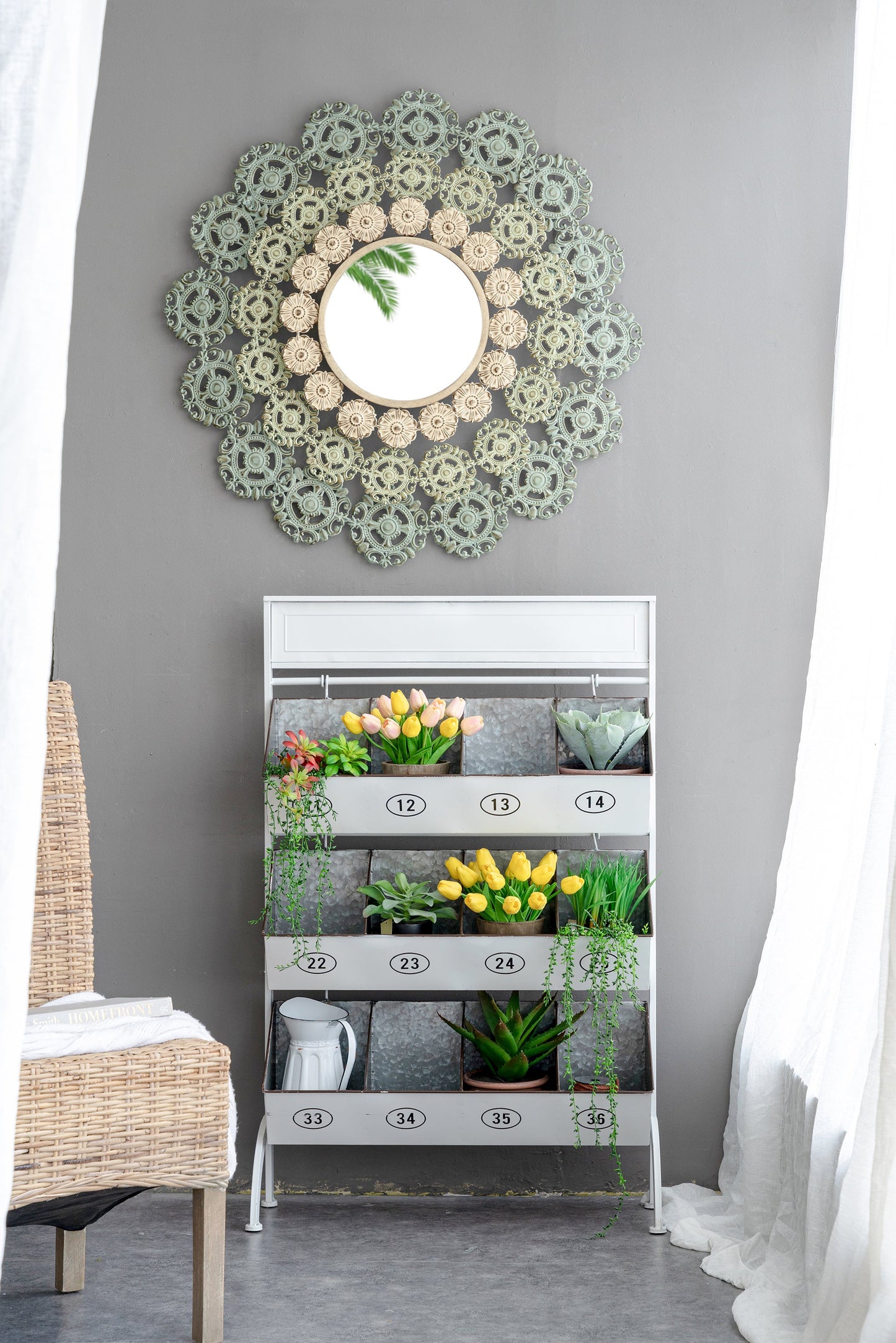 Round Wall Mirror with Floral Accents and Iron Scrollwork