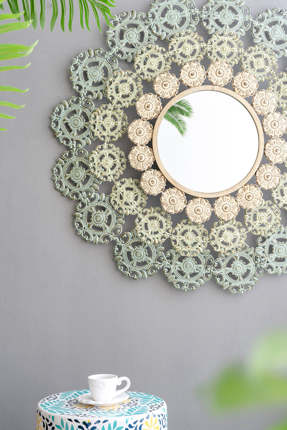 Round Wall Mirror with Floral Accents and Iron Scrollwork