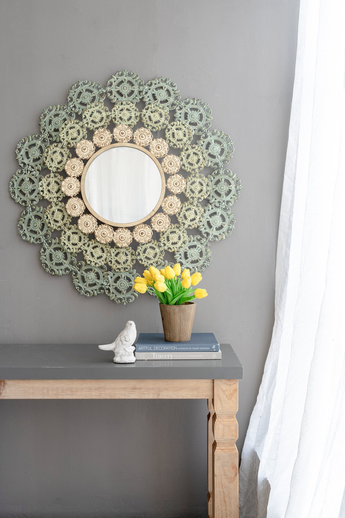 Round Wall Mirror with Floral Accents and Iron Scrollwork