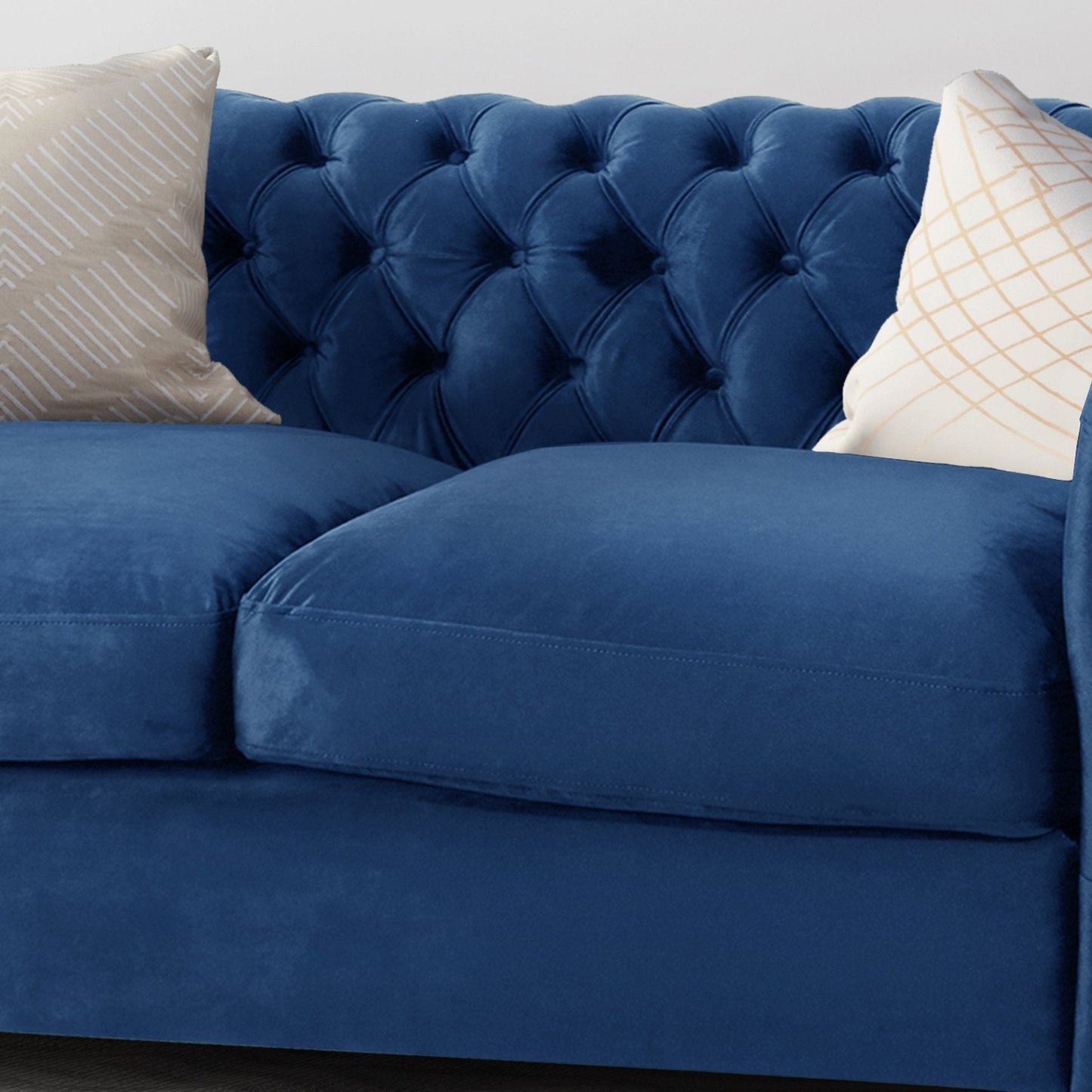 Quixotic Chesterfield Tufted Loveseat with Scroll Arms and Turned Legs