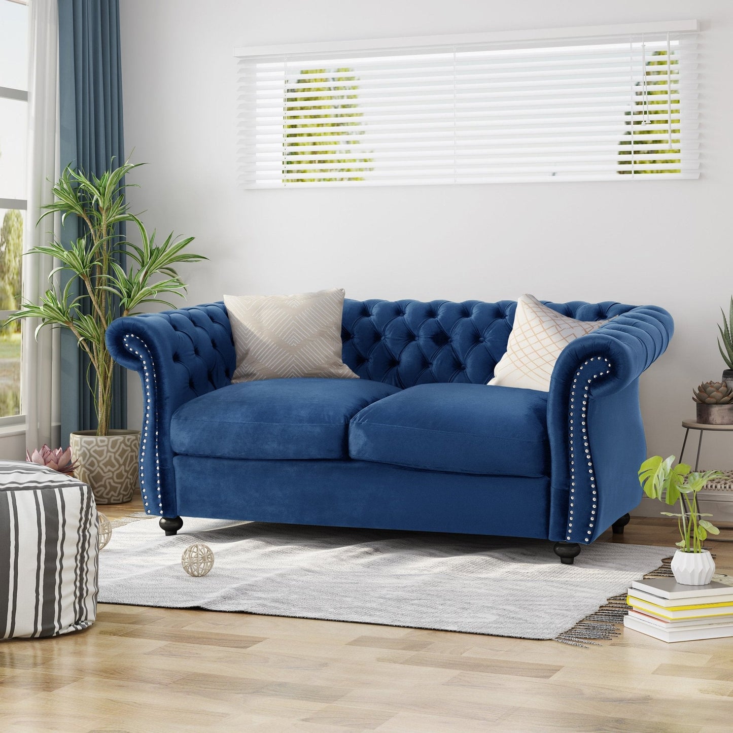 Quixotic Chesterfield Tufted Loveseat with Scroll Arms and Turned Legs