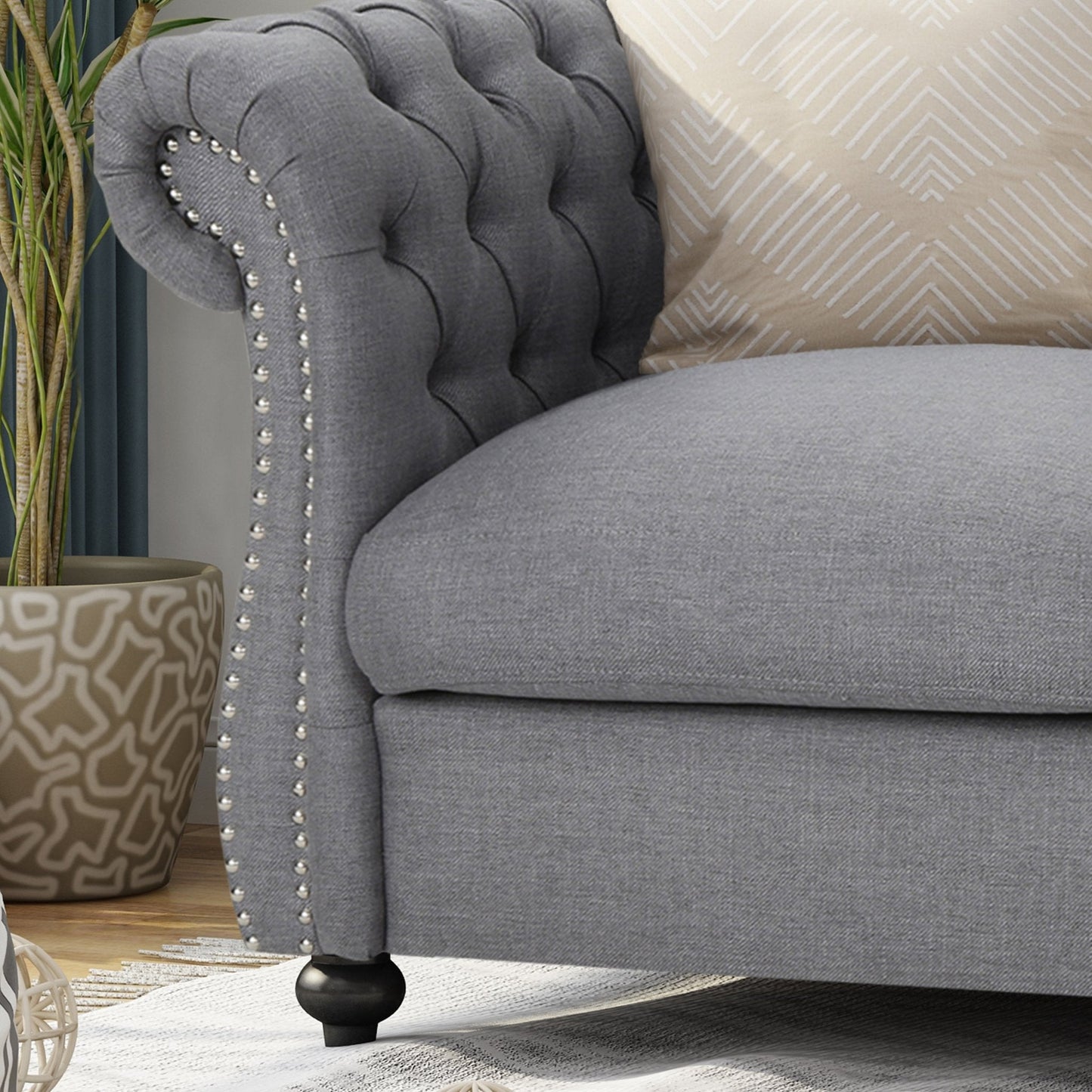Quixotic Chesterfield Tufted Loveseat with Scroll Arms and Turned Legs