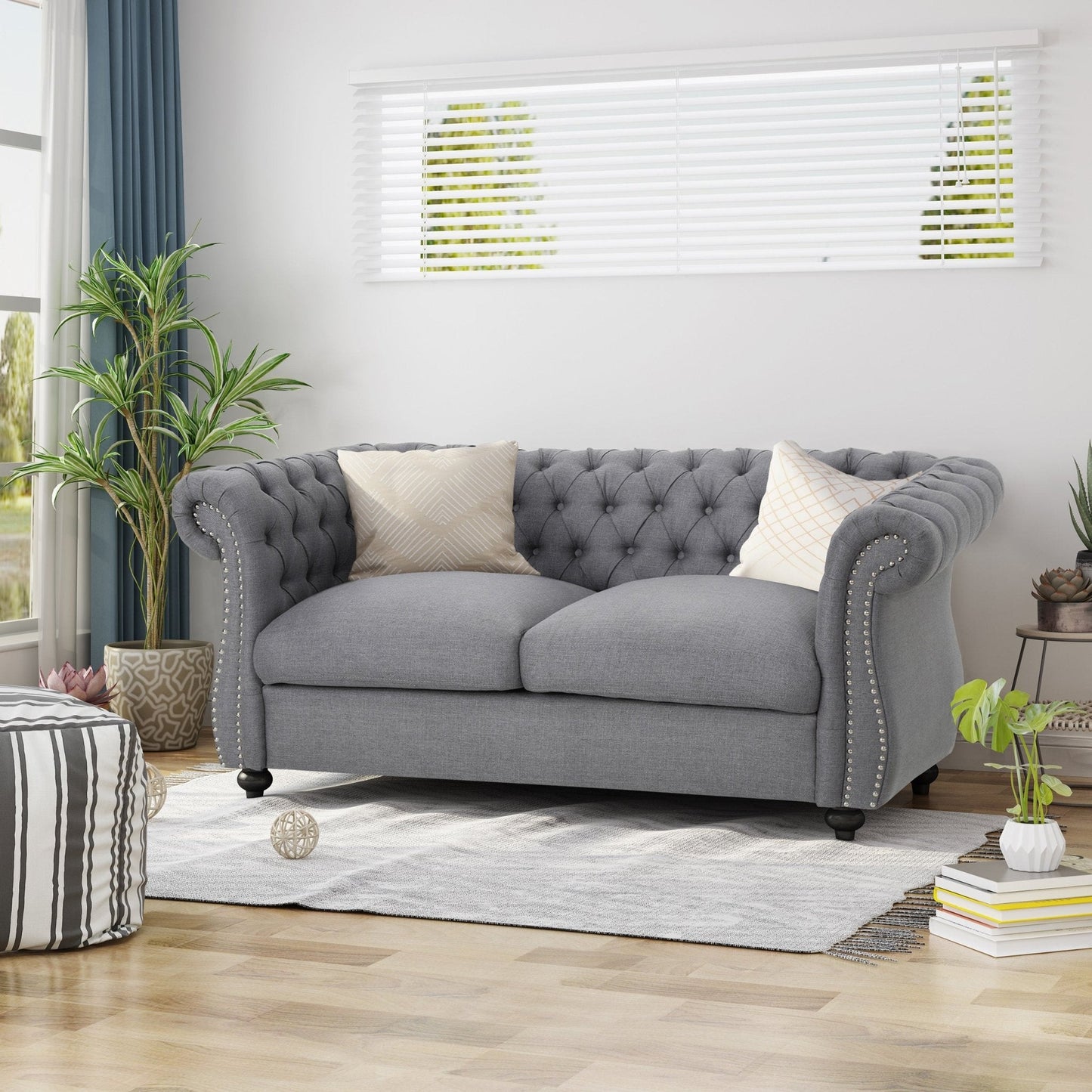 Quixotic Chesterfield Tufted Loveseat with Scroll Arms and Turned Legs