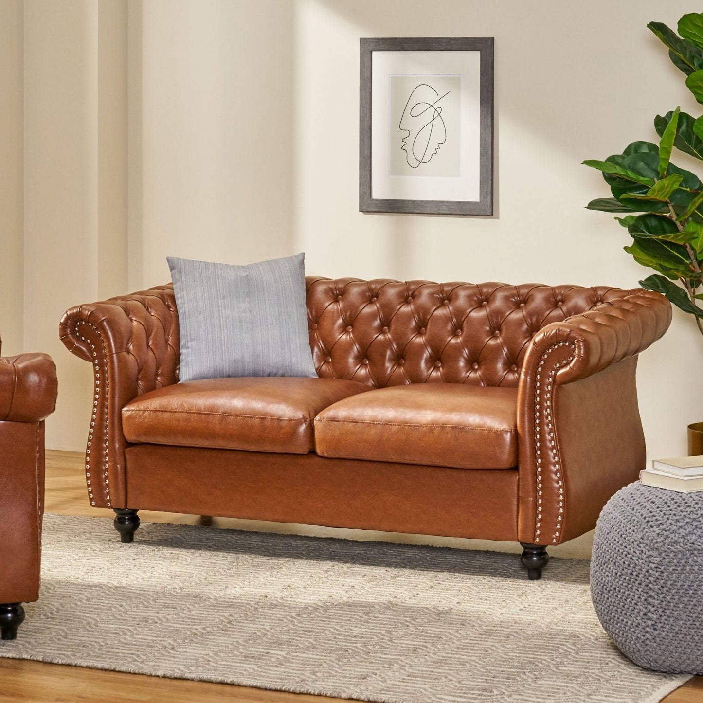 Quixotic Chesterfield Tufted Loveseat with Scroll Arms and Turned Legs